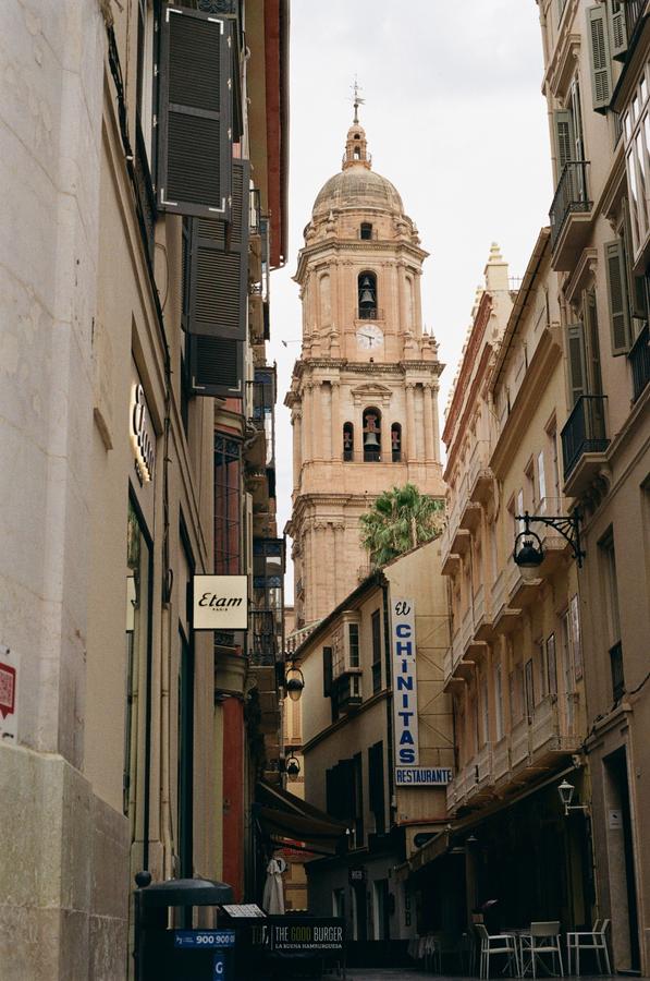 Narrow European alley with cathedral view