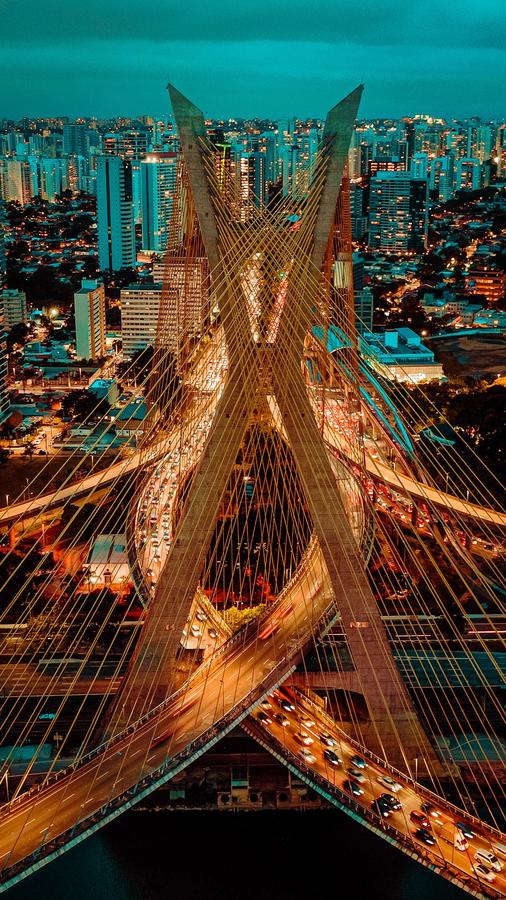 Highway interchange glowing at night